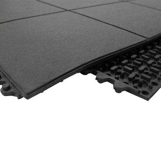 Close-up of anti-fatigue tile edge showing 17mm thickness and air-pocket underside