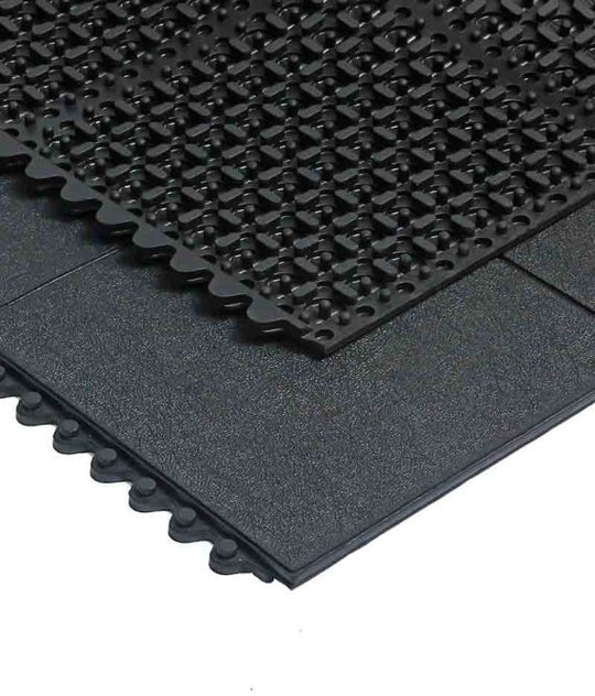 Solid-top anti-fatigue tile with air-pocket underside and interlocking edge connectors