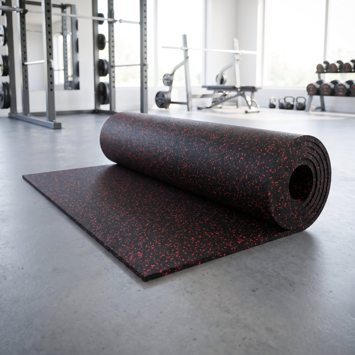 Red Fleck commercial rubber gym flooring roll, 1m x 10m, partly unrolled on a gym floor