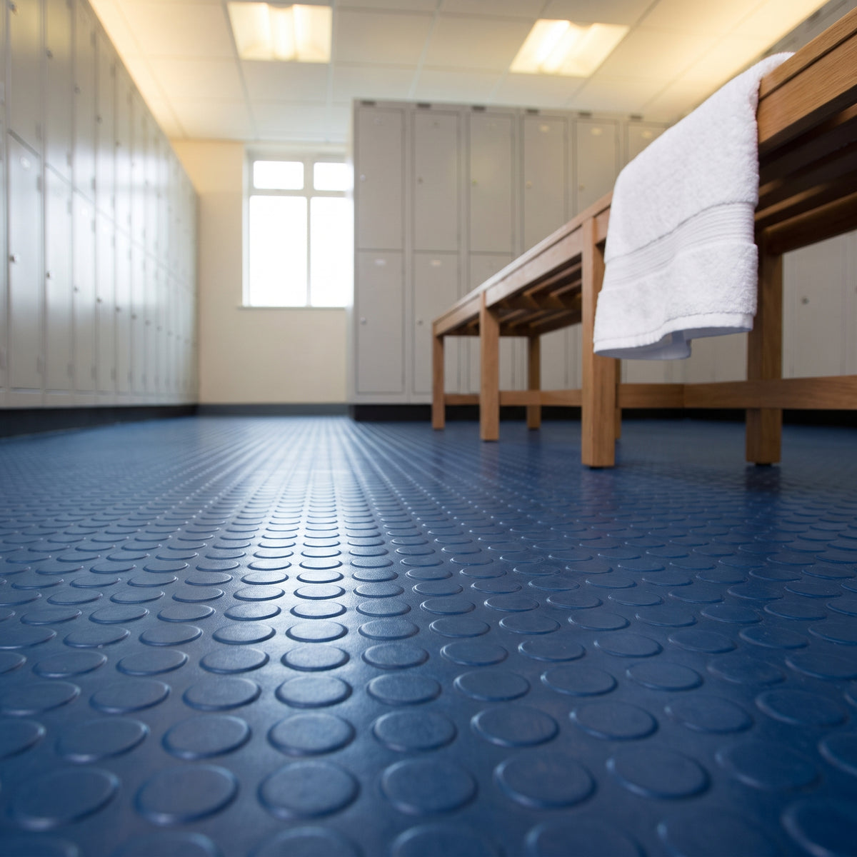 Deep Sea Blue heavy duty dot stud penny pattern rubber floor matting installed in use