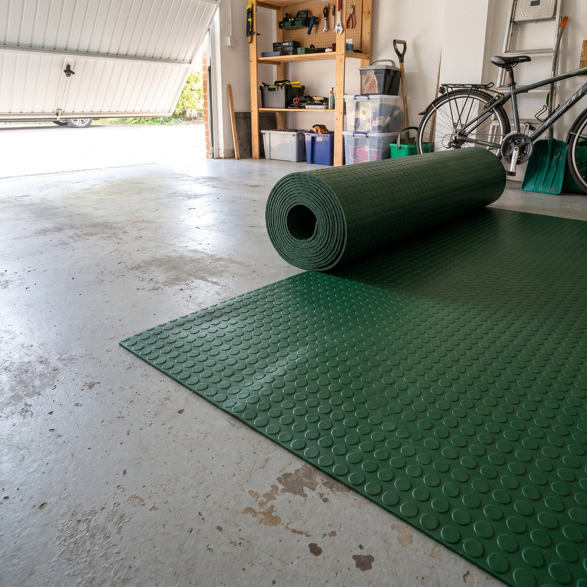 Lush Green round dot rubber safety flooring roll in a garage